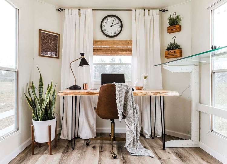 RV home office makeover with white walls, curtains and a wood desk