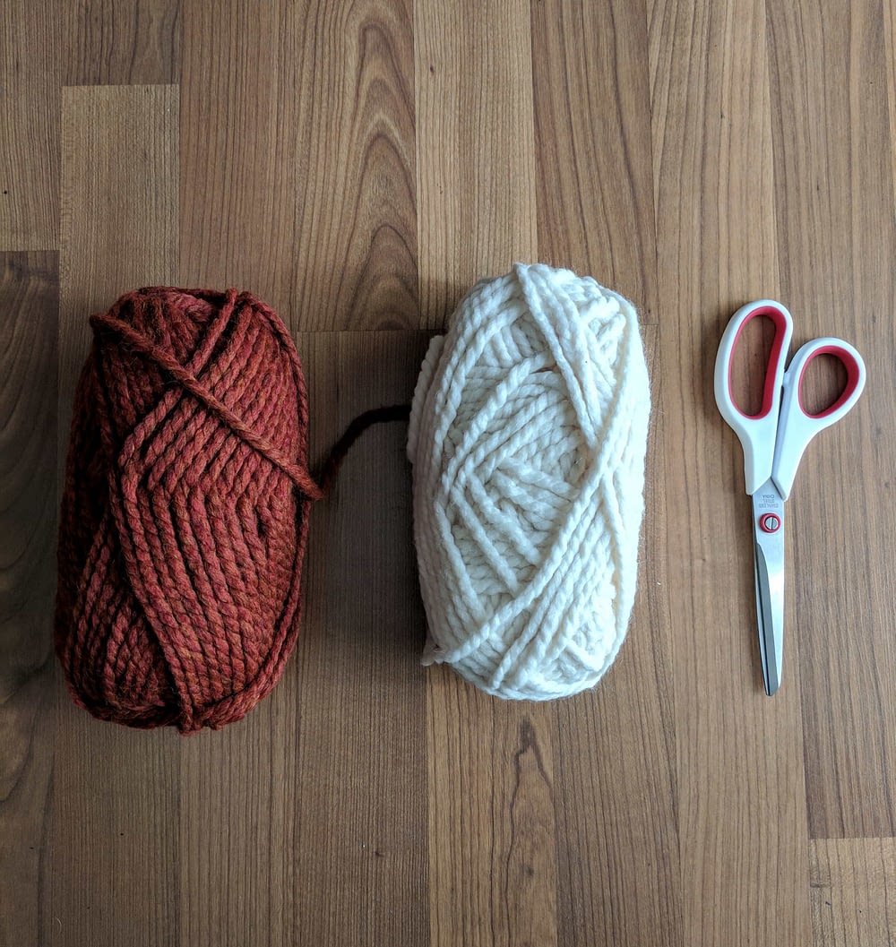 yarn and scissors for making a DIY wall hanging