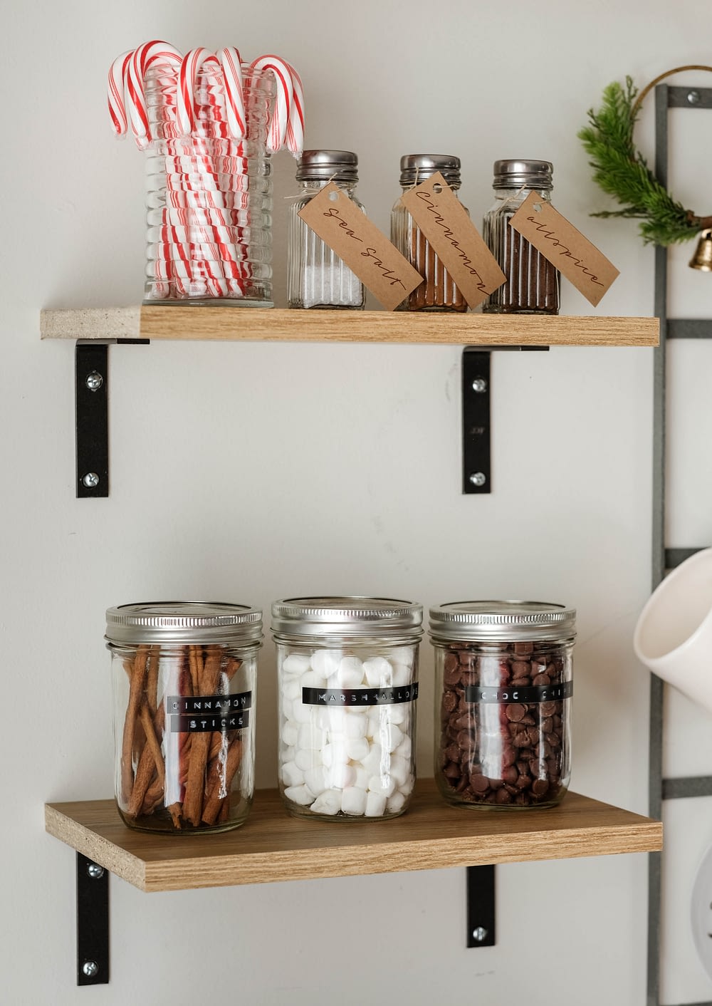DIY Coffee Bar and hot cocoa toppings on open shelves