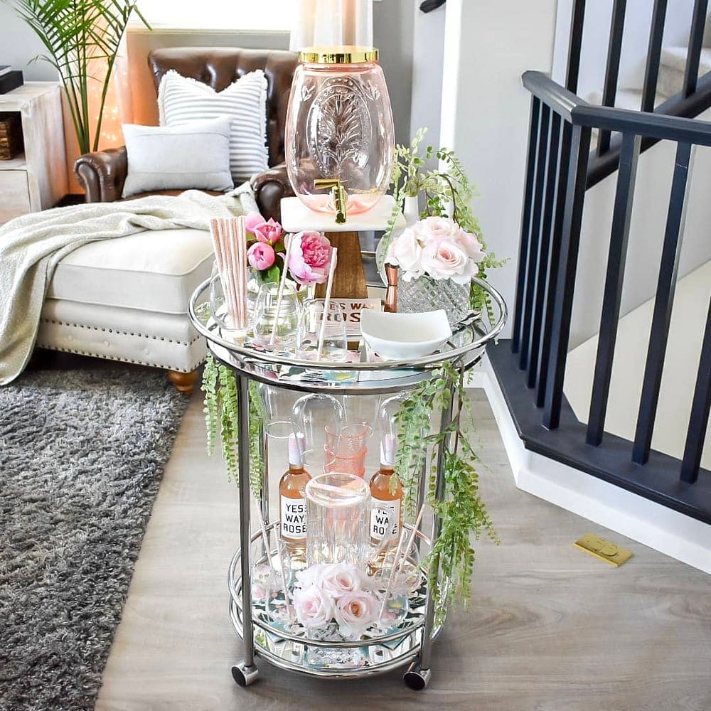 Summer bar cart with glassware and flowers