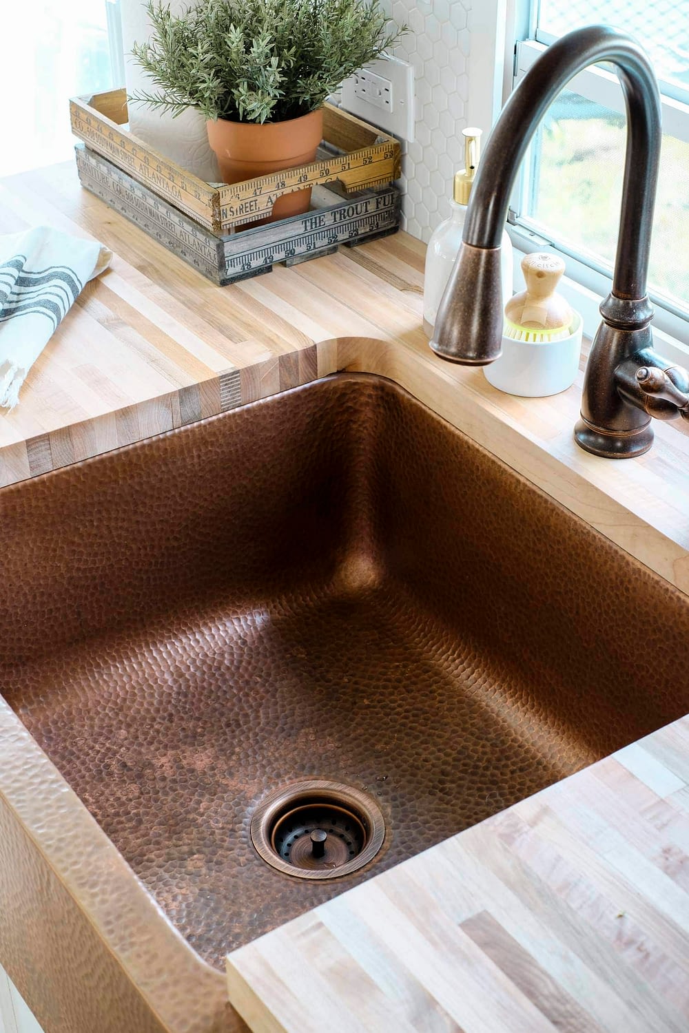 RV kitchen remodel featuring an apron front copper sink