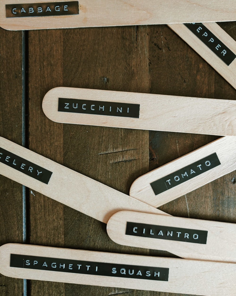Popsicle sticks used as garden crop label stakes