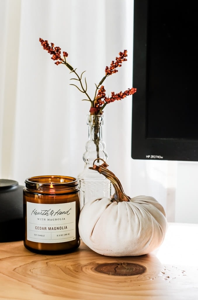 decorating for fall with a candle and linen pumpkin