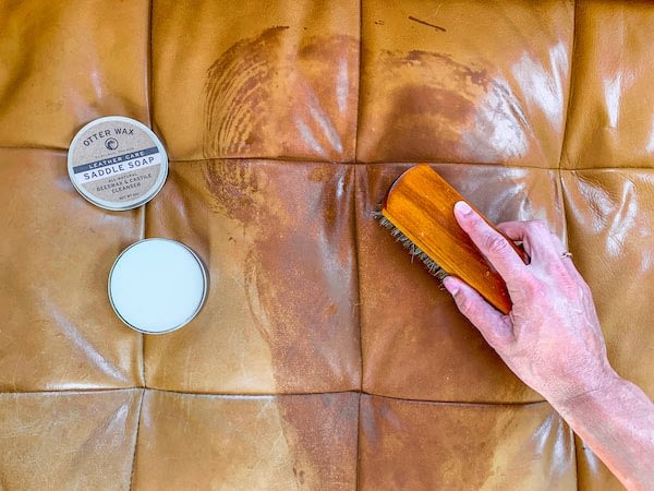 cleaning a spill off a leather sofa