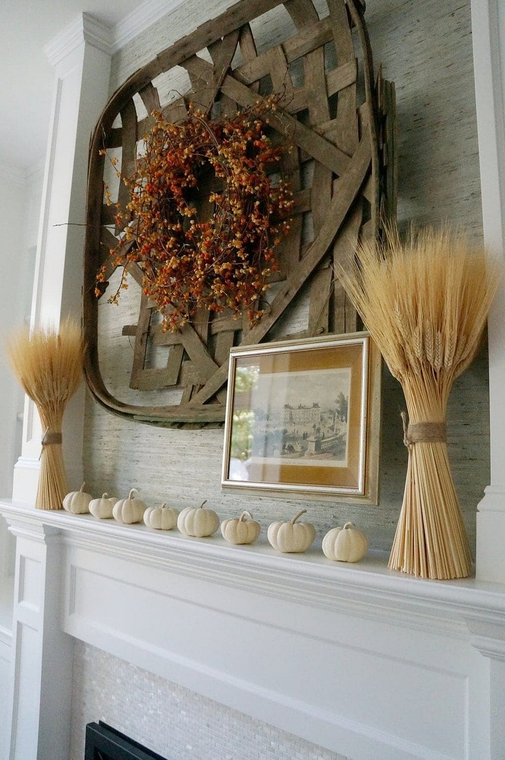 Fall mantel ideas using tobacco baskets, wreaths and dried wheat bundles