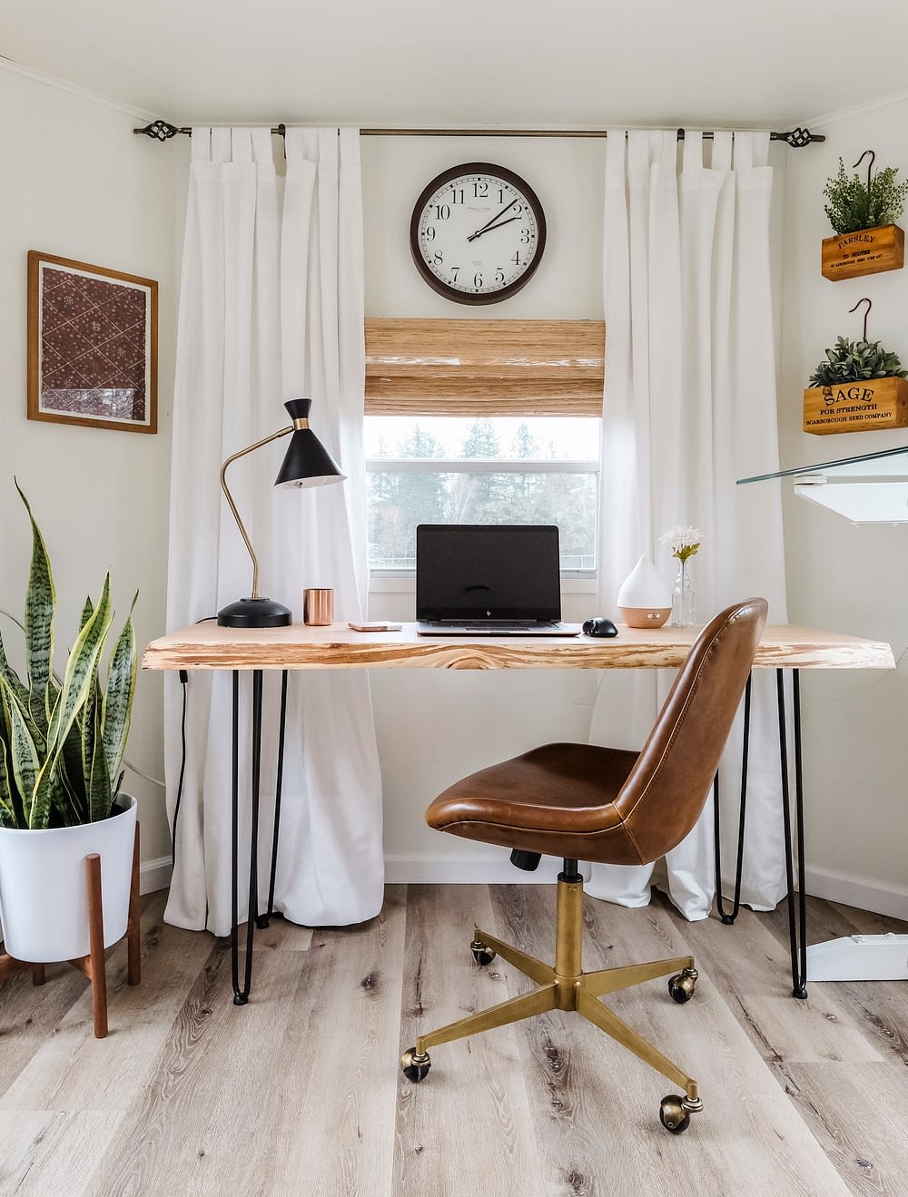 Home office space with modern desk and leather office chair