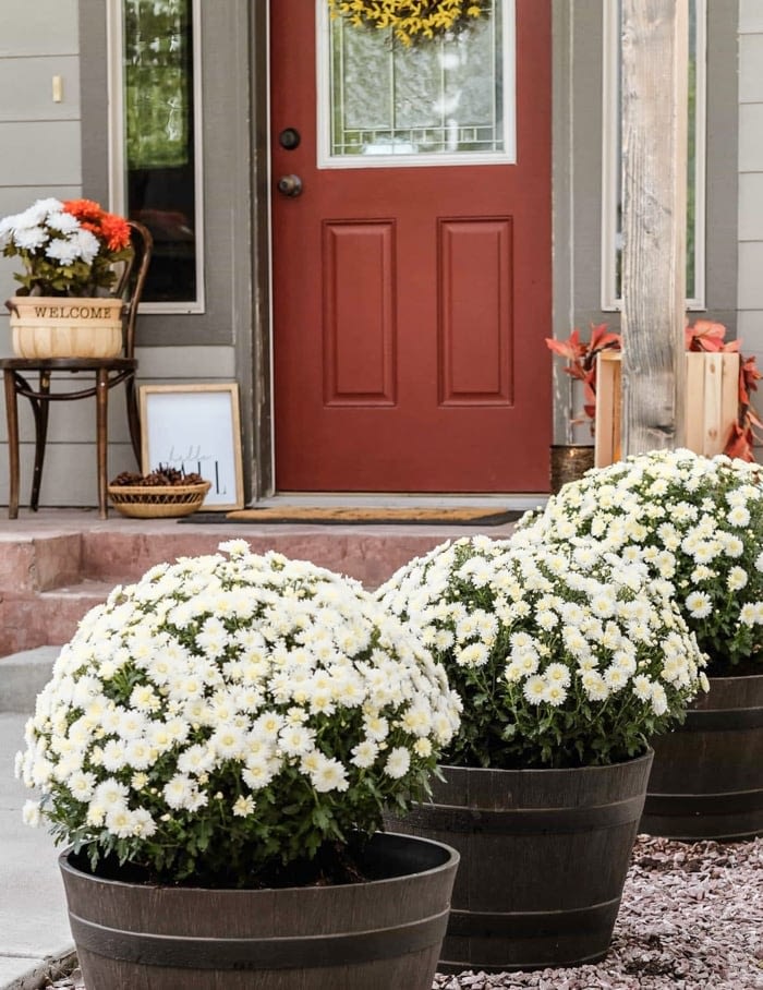 fall front porch decorated with flowers