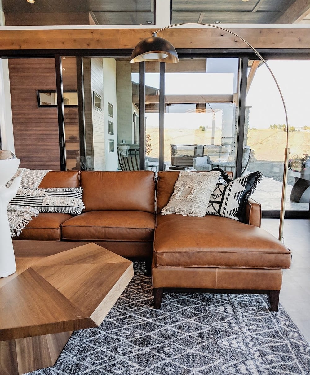 a living room with a leather sectional