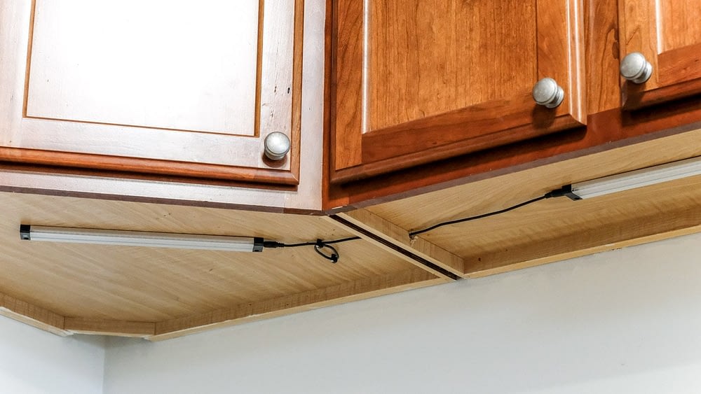 close up of under cabinet lighting and neat wiring in a kitchen