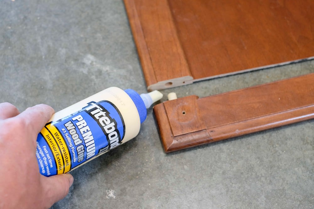 Wood glue gluing a cabinet door back together