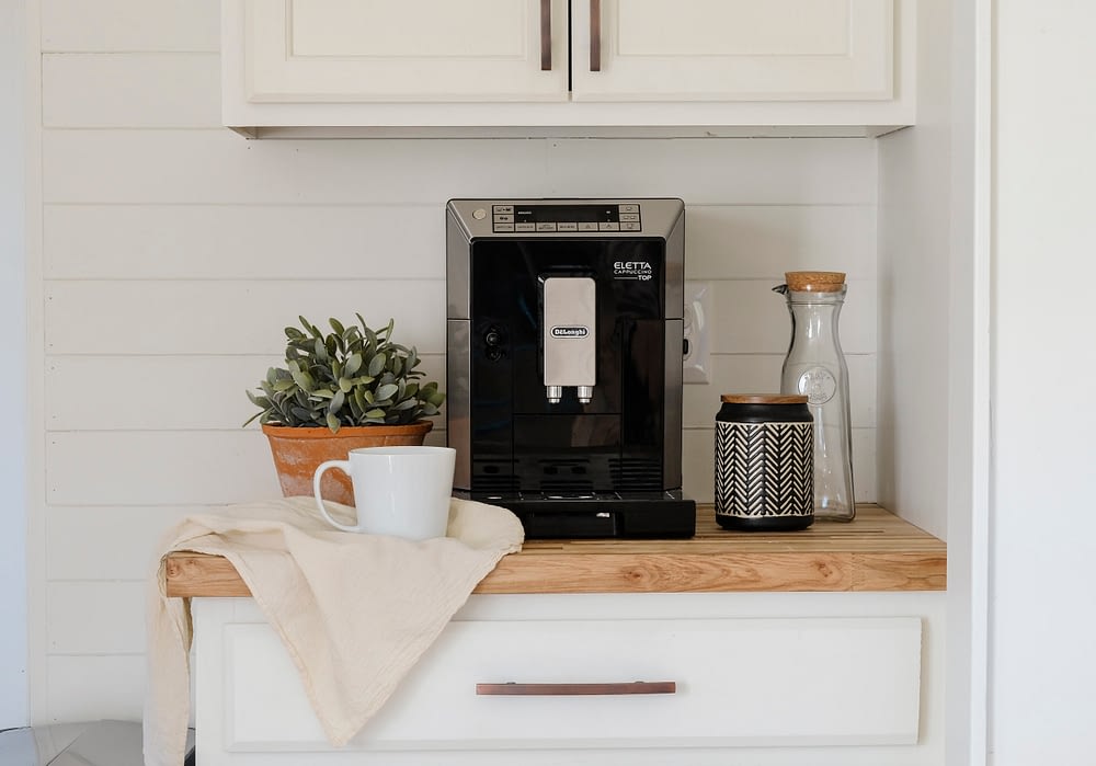 RV kitchen remodel with an espresso machine in front of a shiplap wall