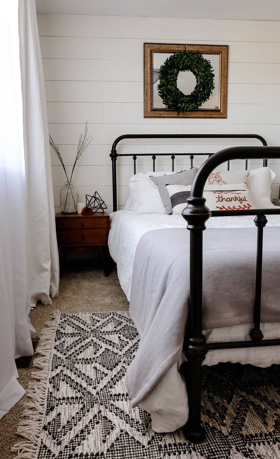 farmhouse bedroom with bed and rug