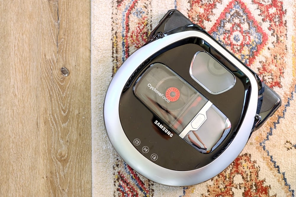 Samsung POWERbot Pet Plus vacuuming a rug