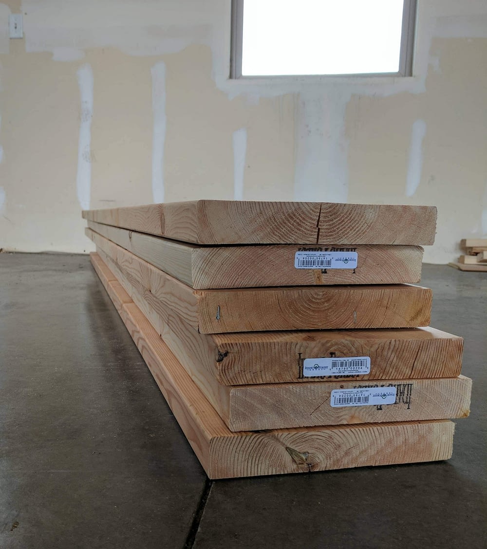 A stack of lumber used to build Raised Garden Beds