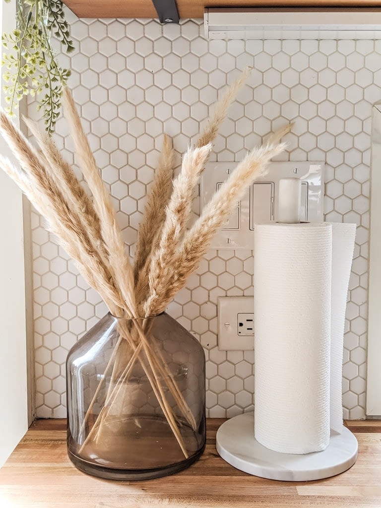 dried pampas grass in a glass vase