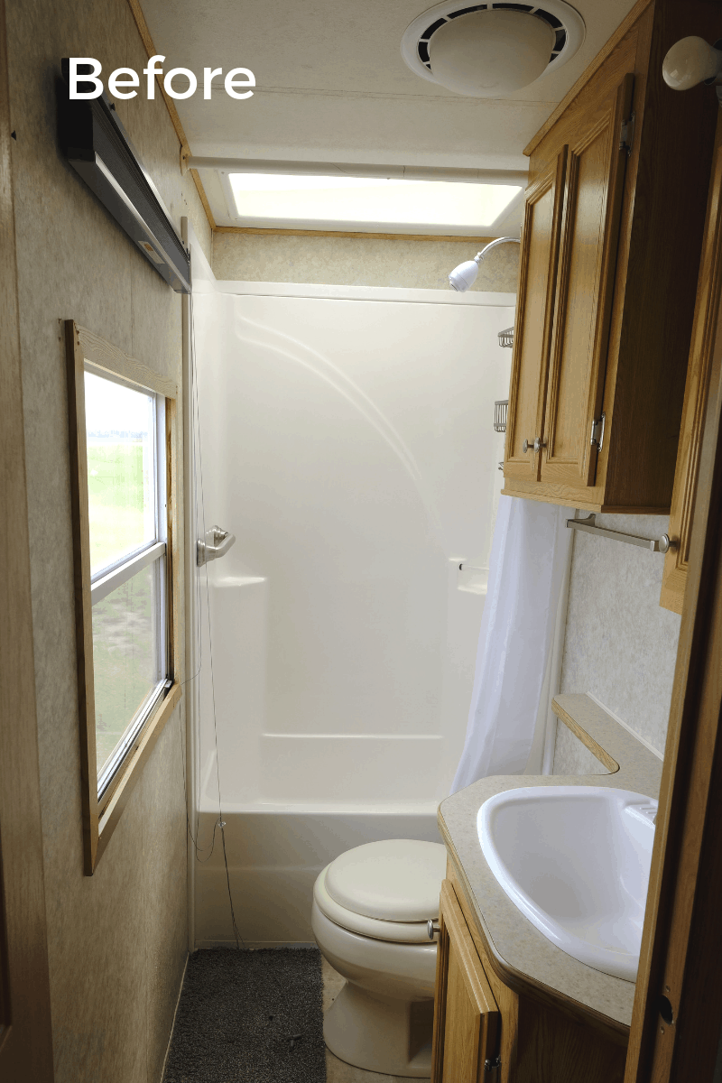 RV bathroom remodel before photo with original fixtures and oak cabinets
