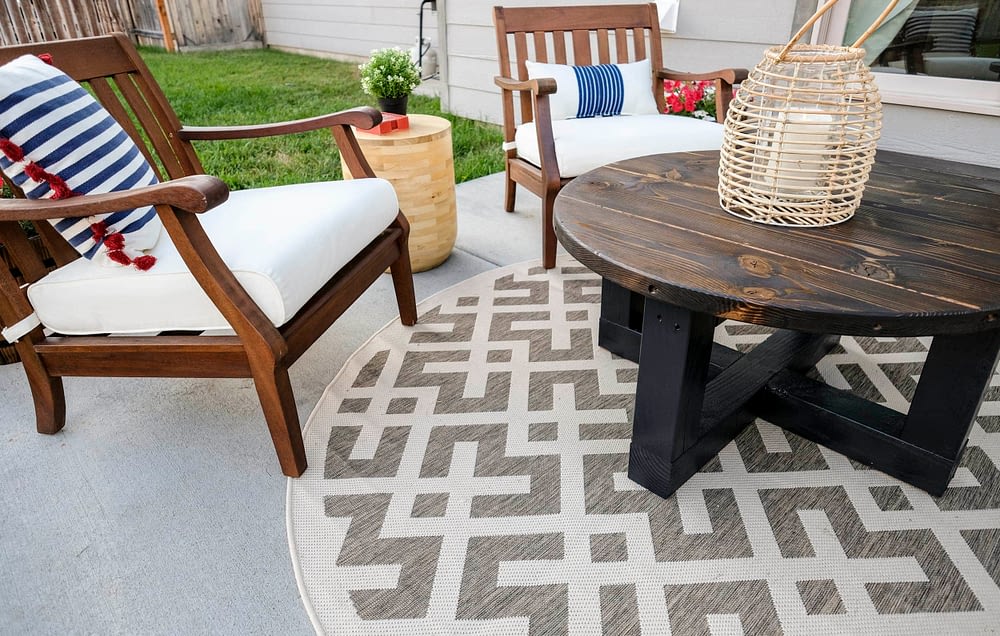 outdoor patio makeover with a coffee table and outdoor rug