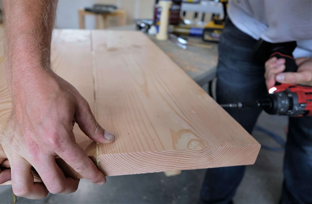 screwing boards together to make rustic coffee table
