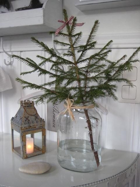 minimalist christmas tree decorations with a branch in a glass jar