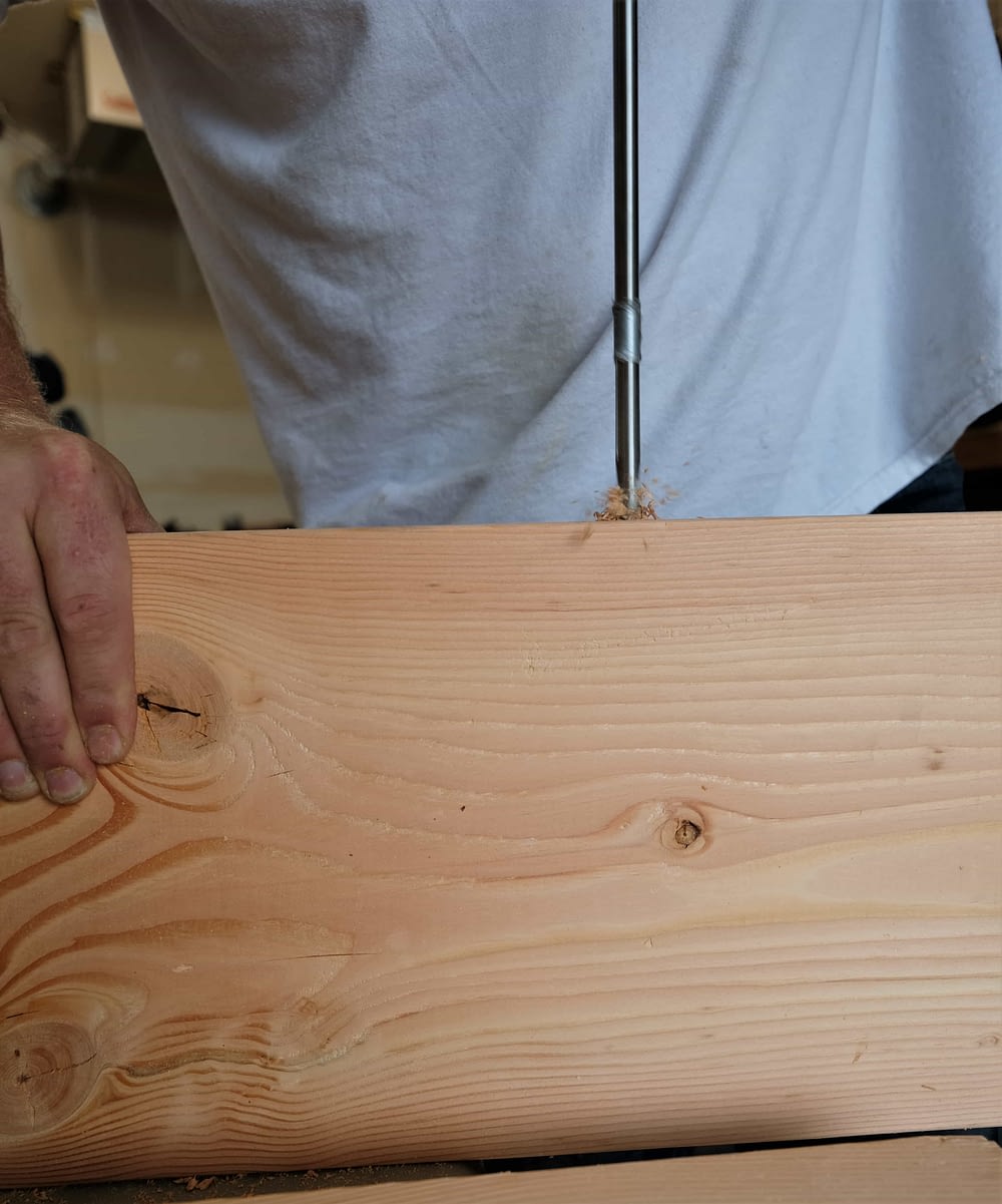 Drilling through board to make rustic coffee table