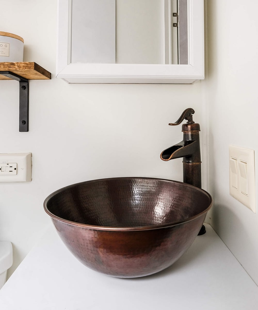 RV bathroom remodel with a copper vessel sink and faucet