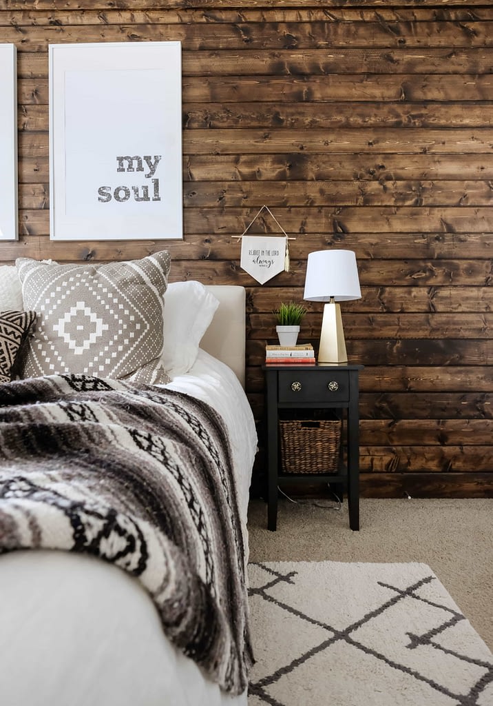 Wood accent wall in a decorated master bedroom 