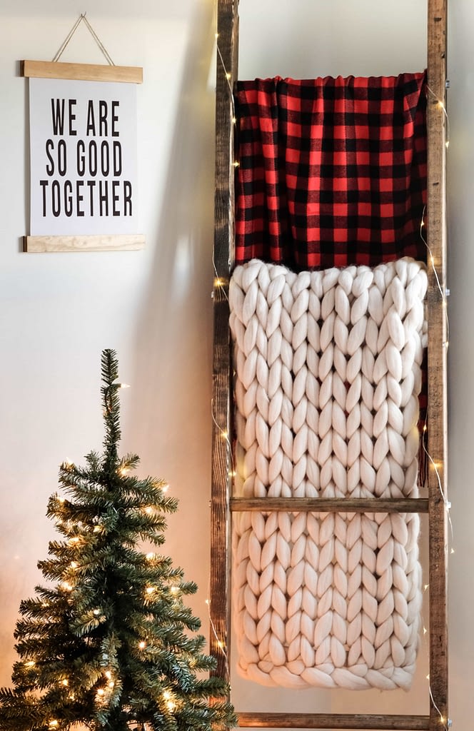 a blanket ladder styled for the holidays