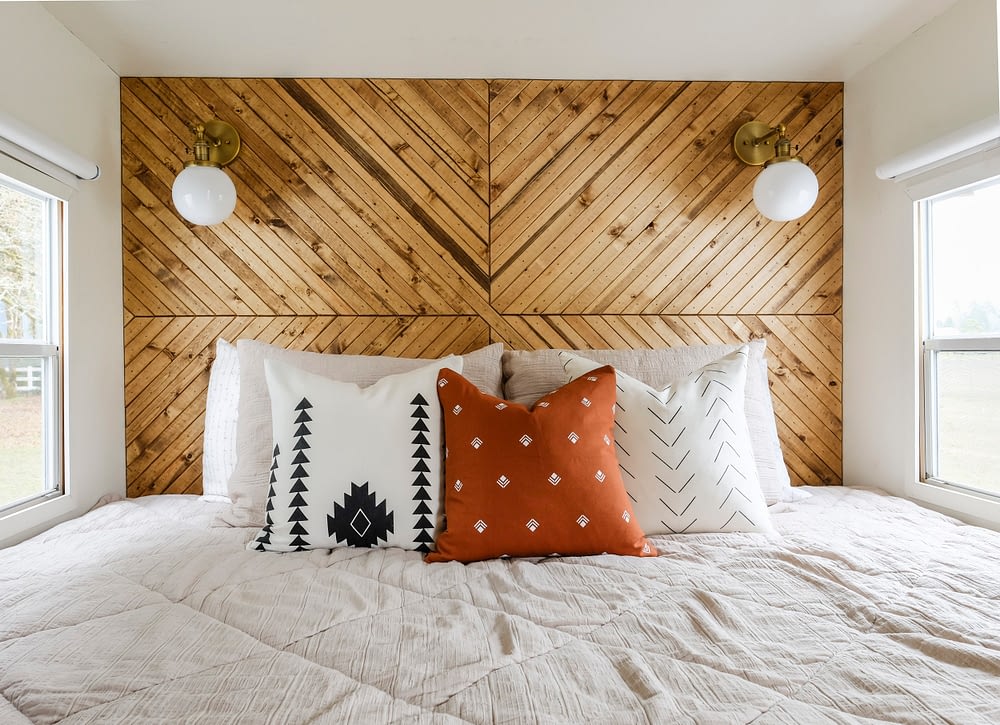 DIY wood wall with modern design behind a bed