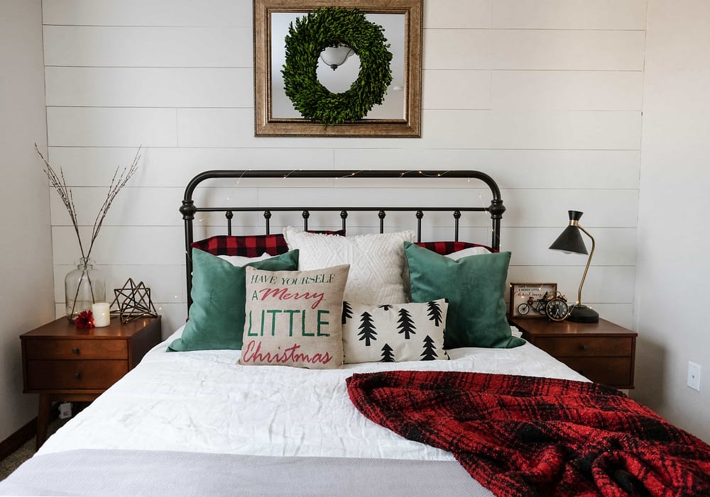 Christmas bedroom decor ideas with throw pillows and a flannel blanket 