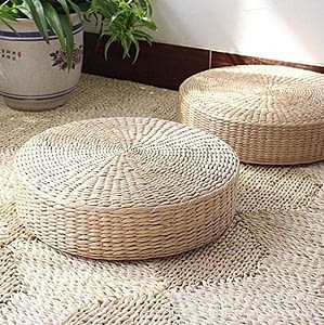 knitted straw floor cushion on a jute rug